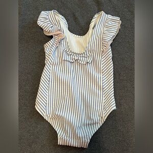 Rufflebutts blue and white stripes one piece swimsuit with little pink ruffles.